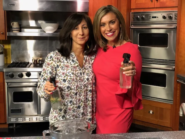 Luisa Szakacs and a television host during a kitchen demonstration