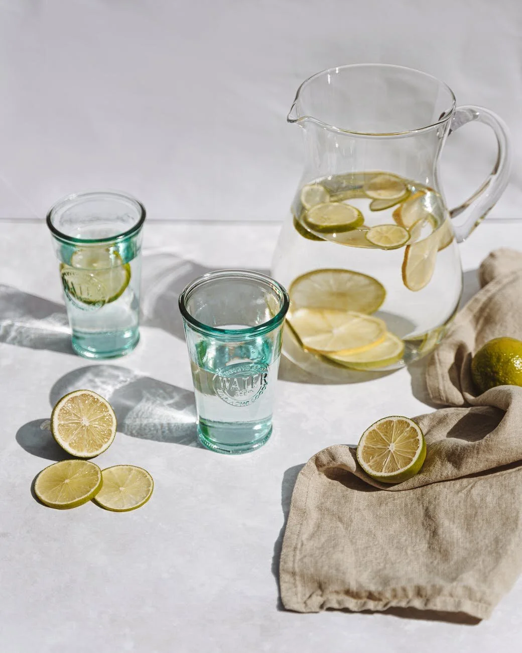 Water and balanced foods arranged for an eating plan