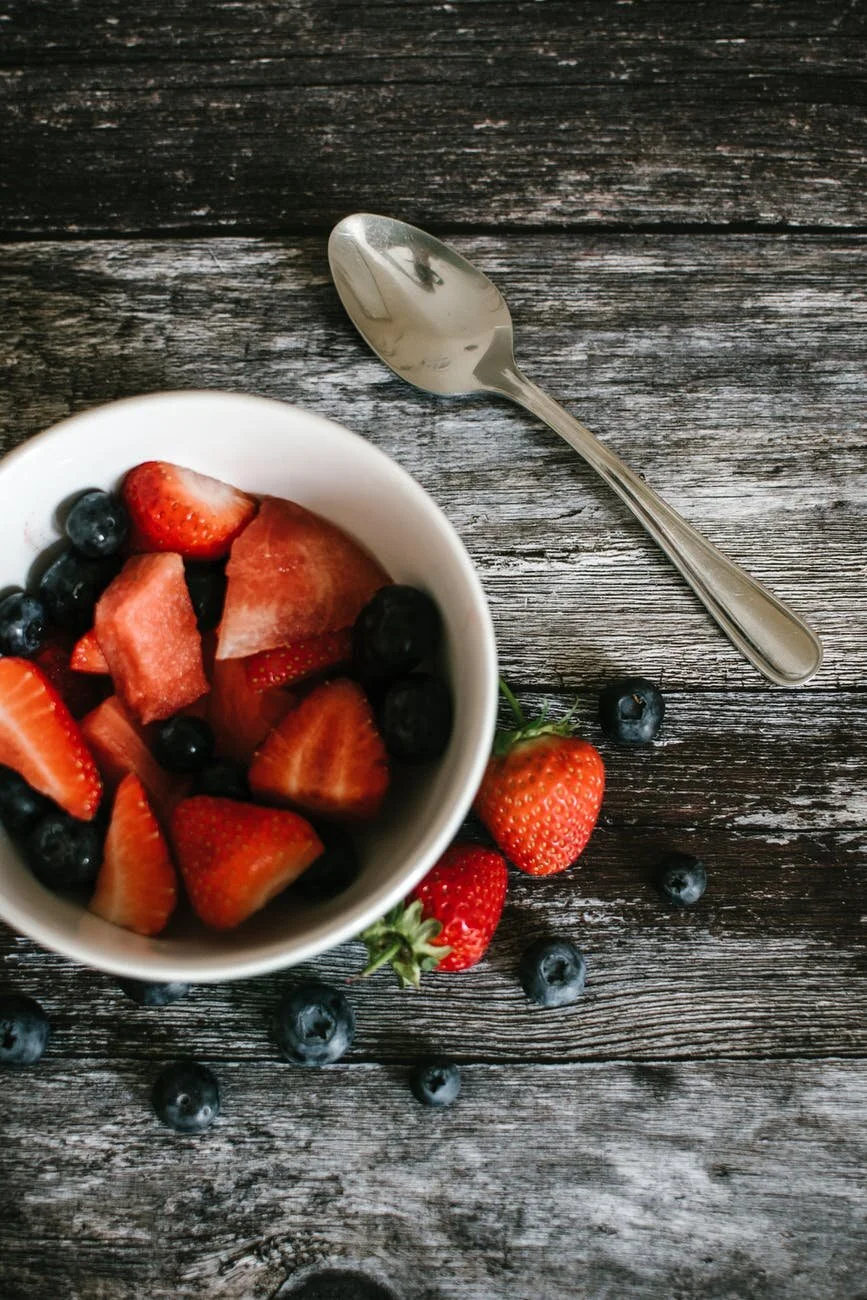 Fresh berries in a dark bowl