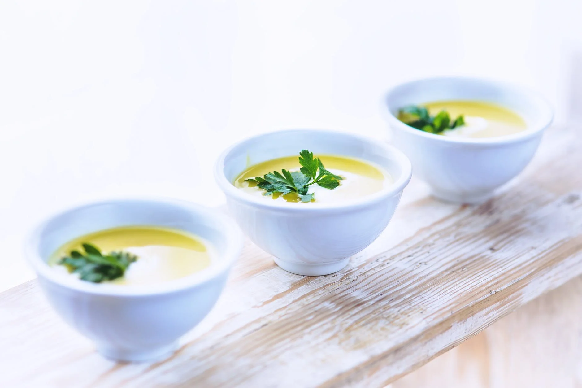 Three bowls of homemade broth