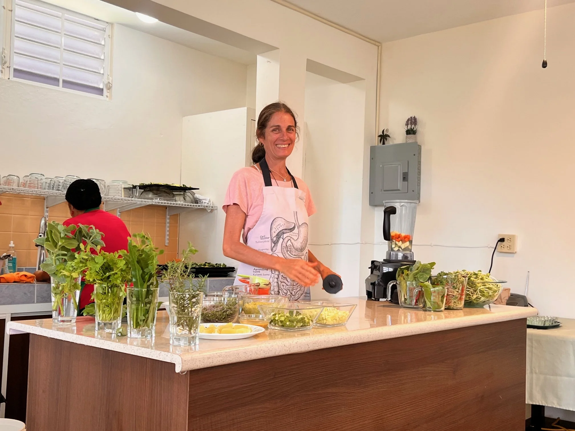 Wheatgrass demonstration in a bright kitchen